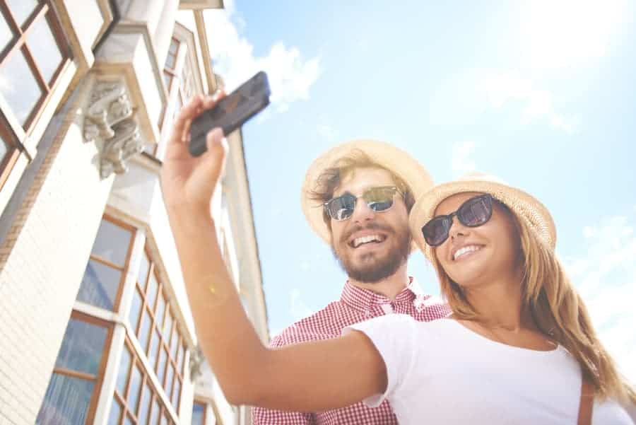 a man and woman taking a selfie