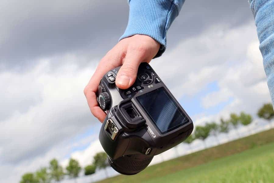 person holding a digital camera